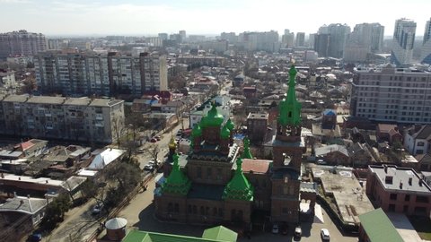 Krasnodar, Russia - March, 14, 2021: The city and the Holy Trinity Church from a bird's-eye view. 4K.