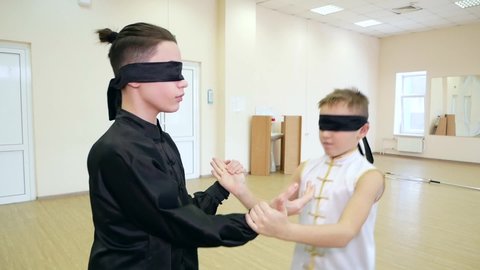 Chelyabinsk, Chelyabinsk region, Russia - 02.06.2022: Guys show a blind fight.

Young athletes are very good at practicing blind fight. Sharp and smooth movements of the arms and body.