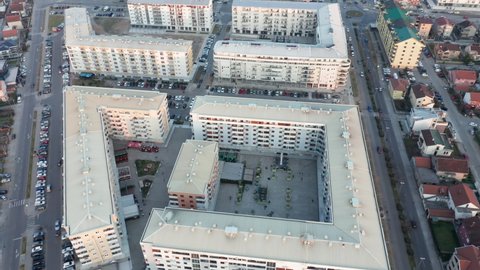 Residential block of high rise apartment buildings made of concrete in a big city in Europe - triangle shaped flat complex in urban environment. Aerial drone view of Podgorica Montenegro.