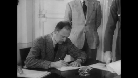 CIRCA 1945 - Nazi General Wolff signs documents surrendering the campaign in Italy, which are then signed by General Morgan on behalf of the allies.