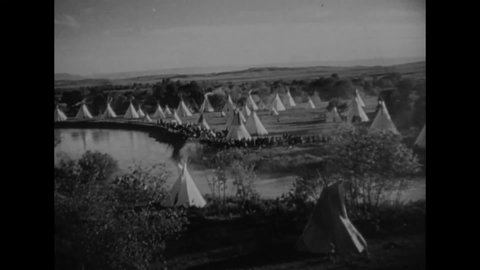 CIRCA 1934 - In this western film, oil rigs replace teepees on native land.