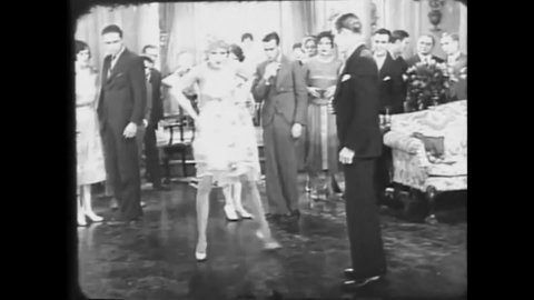 CIRCA 1928 - In this silent comedy, a flapper scandalizes people at a party with her dancing.