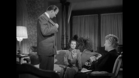 CIRCA 1949 - In this film noir, a man jokes that he can't afford to put on the weight when his hostess offers him a drink.