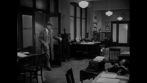 CIRCA 1949 - In this film noir, an investigative reporter working on a story about missing babies bosses his assistant around.