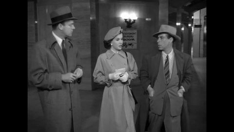 CIRCA 1949 - In this film noir, a reporter harasses a woman trying to fill out a missing persons form for her sister.