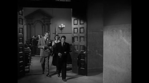CIRCA 1949 - In this film noir, a man bribes a gangster to tell him about an adoption racket.