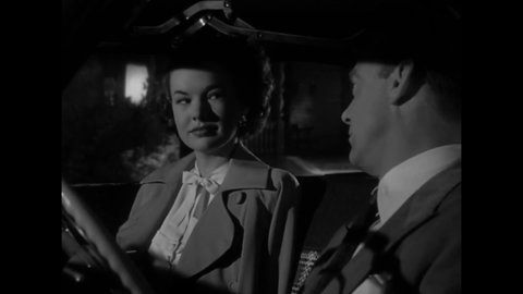 CIRCA 1949 - In this film noir, a couple flirts while on a stakeout.