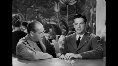 CIRCA 1946 - In this film noir, a man takes his friend to a nightclub for a drink and chides him for watching the clock.