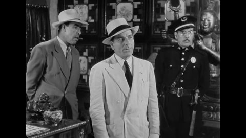 CIRCA 1946 - In this film noir, a man confesses to a murder he didn't commit just to buy time to escape the police.