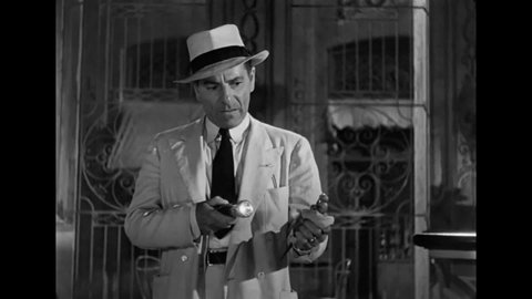 CIRCA 1946 - In this film noir, a man accused of fatally stabbing his girlfriend in a Havana nightclub is asked to describe what his knife looks like.