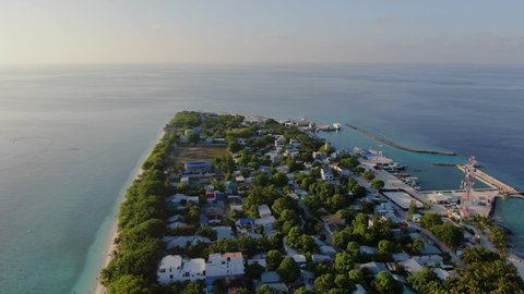 Ukulhas Maldive island sunset aerial view
Flyig under paradise atoll with coral reef, sandy bay and palms