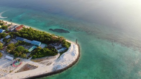 Ukulhas Maldive island sunset aerial view
Flyig under paradise atoll with coral reef, sandy bay and palms