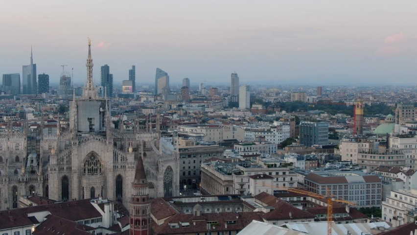 Establishing Aerial Shot of Milan Cathedral Piazza Del Duomo Di Milano And `Milano Skyline At Sunset, 4K Footage in Milan Italy Royalty-Free Stock Footage #1088926499