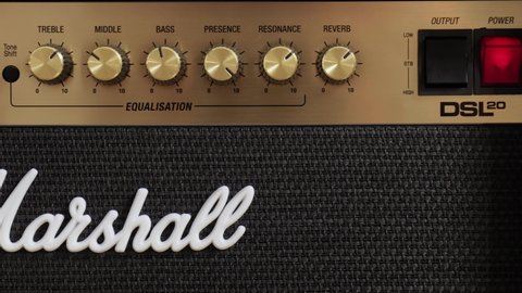 Budapest, Hungary - Circa 2021: Marshall guitar amplifier closeup of tone control knobs. Classic looking DSL20 combo