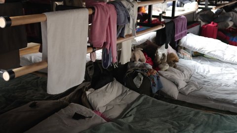 Millions of refugees from the war-torn territories are flees to europe. Mother and child room. Mattresses, pillows, blankets are waiting for refugees, temporary housing during humanitarian disaster