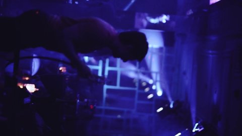 Nizhny Novgorod, April 2, 2022. A man dances in a club with a hookah, vertical video