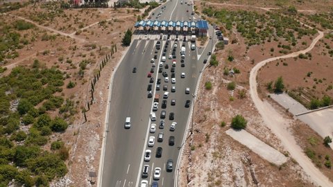 SPLIT, CROATIA - August 12 2021: Aerial view of the traffic waiting at toll booths in Dugopolje in summer time.
