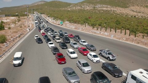 SPLIT, CROATIA - August 12 2021: Aerial view of the traffic waiting at toll booths in Dugopolje in summer time.