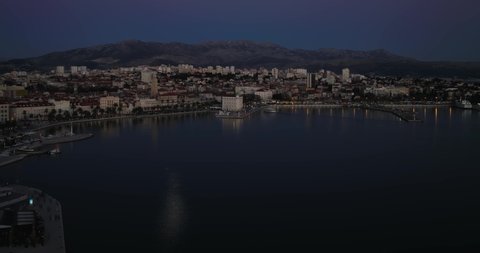 SPLIT, CROATIA - January 16 2022: Aerial timelapse view of the old historic city and Diocletian palace at sunset.