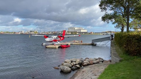 Copenhagen, Denmark - October 17 2021: A DHC-6 Twin Otter seaplane (Registration: HB-LWB) docked at the pier