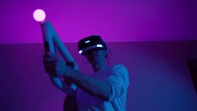 Man with virtual reality headset and joystic is playing game - Powered by Shutterstock - Get 15% off with code: PIKWIZARD15