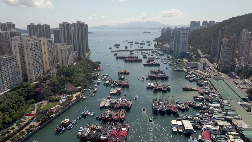 Aerial view of boats in Aberdeen harbour. Hong Kong. Sunny day. Popular travel destination in Asia. Old fishing boats. 