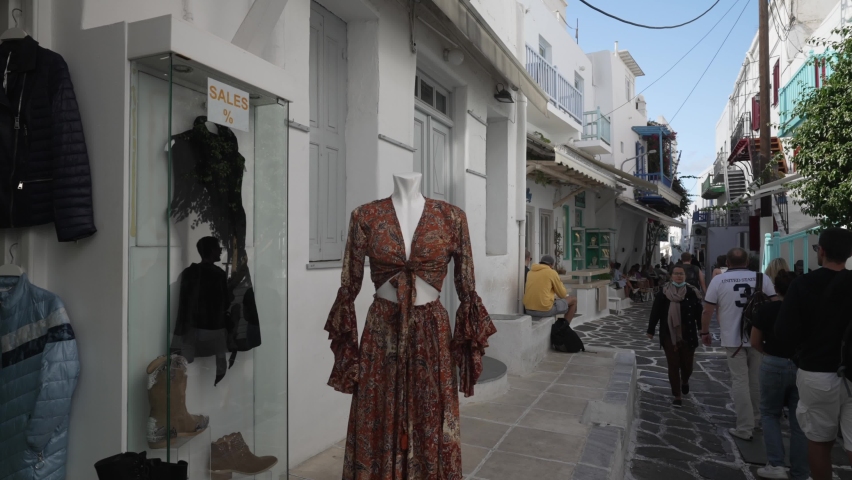 Shops and people on whitewashed street in Mykonos Town, Mykonos, Cyclades, Greek Islands, Greece, Europe