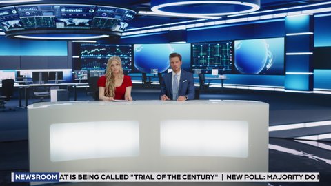 TV Live News Program: Two Professional Presenters Reporting On the Events. Television Cable Channel Newsroom Studio: Male and Female Anchors Talk. Mock-up Broadcasting Network Playback. Wide Shot