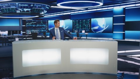 Beginning of TV Live News Program: Presenter Reporting, Talking Charismatically, Discussing Daily Events. Television Cable Channel Anchor Talks Politics, Science. Playback Newsroom Studio. Wide Shot