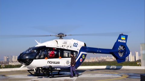 Kiev, Ukraine- February 14, 2021: Rescue helicopter of the Ukrainian police stands on the roof of the building and prepares to take off.