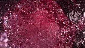 Super Slow Motion Shot of Raspberry Lemonade Whirling and Splashing in Glass Bottle at 1000fps. - Powered by Shutterstock - Get 15% off with code: PIKWIZARD15