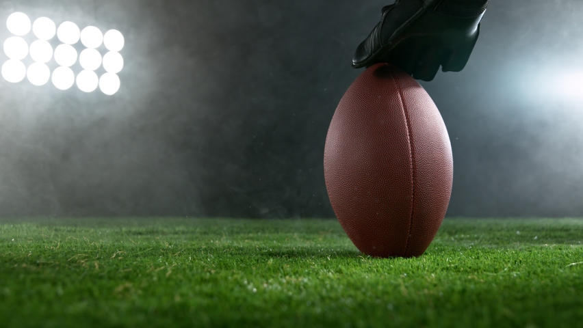 Close-up of American Football Player Kicking Ball, Super Slow Motion at 1000 fps. Filmed on High Speed Cinematic Camera. Royalty-Free Stock Footage #1088954733