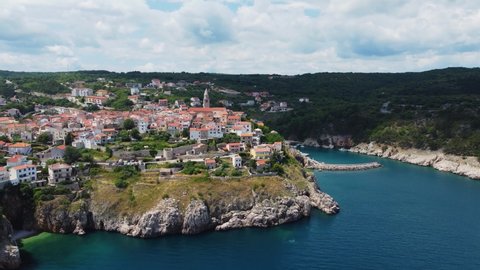 Aerial view of Vrbnik town peninsula with an old clock tower on Krk island Croatia