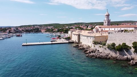 Krk Village at Krk Island, Croatia - Aerial Drone View of the Bay with Church, Cathedral, City Walls, Port, Boats and Boulevard at the Adriatic Sea