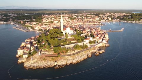 Rovinj at Istria, Croatia - Aerial Drone View (Circle Shot) of the Peninsula with Boulevard, Church Tower, Colorfol Houses and Port at the Adriatic Sea