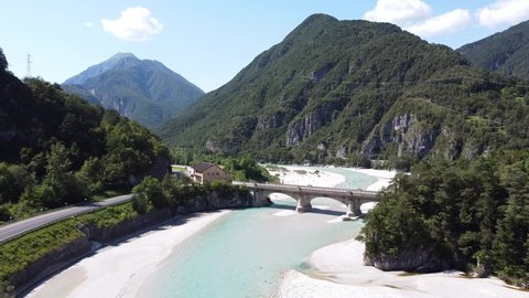 Tagliamento River at Tolmezzo, Udine, Italian Alps, Italy - Aerial Drone View of the Riverbed, Streaming Blue Gletsjer Water and Road through the Mountains