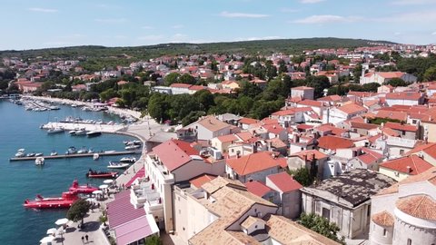 Krk Village at Krk Island, Croatia - Aerial Drone View of the Church, Cathedral, City Walls, Port, Boats and Boulevard at the Adriatic Sea