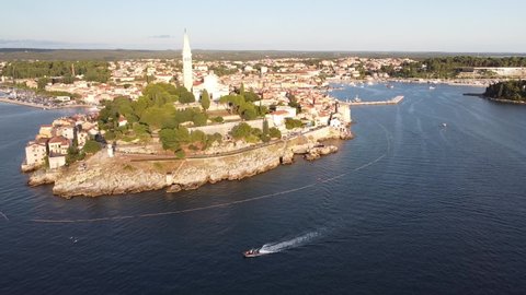 Rovinj at Istria, Croatia - Aerial Drone View (Fly Over) of the Peninsula with Church Tower, Boulevard, Colorfol Houses and Port at the Adriatic Sea