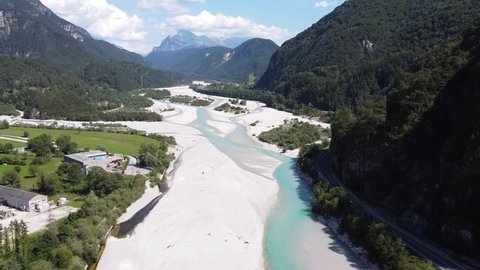 Tagliamento River at Tolmezzo, Udine, Italian Alps, Italy - Aerial Drone View of the Riverbed and Streaming Blue Gletsjer Water