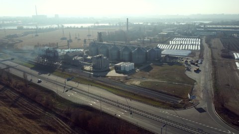 View of Elevator. Metal Structure of Granary. Granary Metal Complex. Aerial Drone View Building for Drying and Storage of Grain. Reinforced Concrete Structure of the Grain Elevator. Highway and Cars