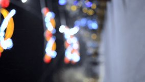 Blurred background of snowy city street with Christmas trees and illumination decoration during snowfall on winter night. People walking street. Abstract Christmas New Year background. Vertical video - Powered by Shutterstock - Get 15% off with code: PIKWIZARD15