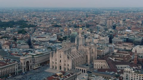 Aerial Drone Of Milan Cathedral Piazza Del Duomo Di Milano, Galleria Vittorio Emanuele City Center And `Milano Skyline At Sunset