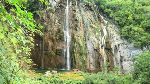 Veliki slap waterfall and sunshine of Plitvice Lakes National Park in Croatia in the Lika region. UNESCO World Heritage of Croatia named Plitvicka Jezera.