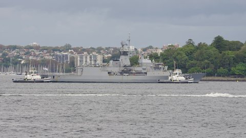 Sydney, Australia - Mar 25, 2022: Tracking shot of Royal Australian Navy HMAS Parramatta Anzac Class Frigate returning to base in Sydney