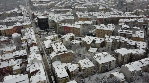Sofia Bulgaria, February 2022. View with a drone from the capital on a snowy day. The roofs of the buildings are covered with snow.