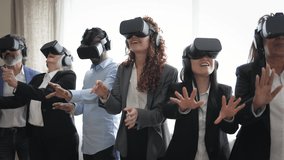 Multiracial business people wearing futuristic virtual reality glasses technology - Metaverse concept - Powered by Shutterstock - Get 15% off with code: PIKWIZARD15