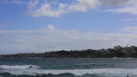 Surfers riding the waves at Bondi Beach