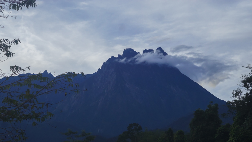 4K Close up Timelapse of Mount Kinabalu with dramatic cloud movement. Tilt Down effect