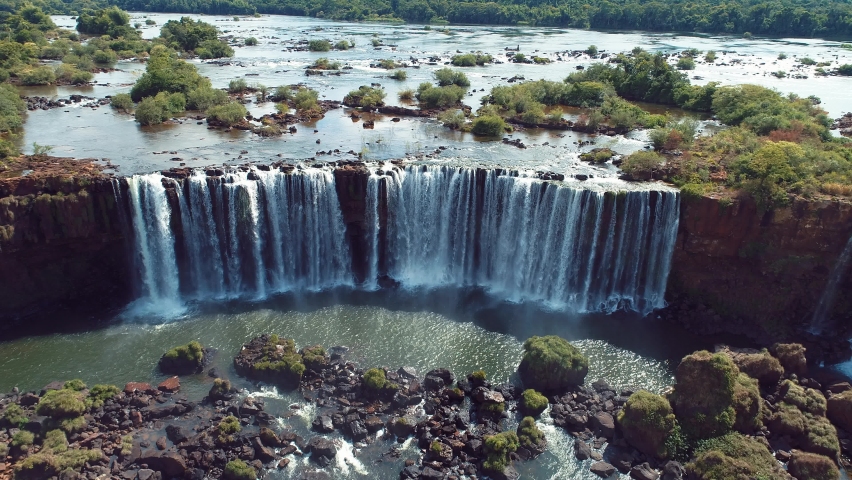 Aerial nature landscape of Iguazu Falls giant waterfalls of south america. Brazilian border at Foz do Iguacu Parana Brazil. Famous Famous Cataratas do Iguacu waterfalls. Iguazu falls destination. Royalty-Free Stock Footage #1088988103