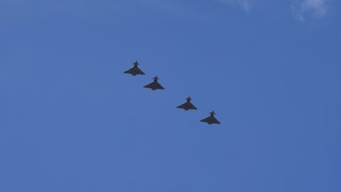 Gran Canaria Spain OCTOBER, 21, 2021 Four military fighter jet aircrafts break the formation for landing. Eurofighter Typhoon of Spanish Air Force